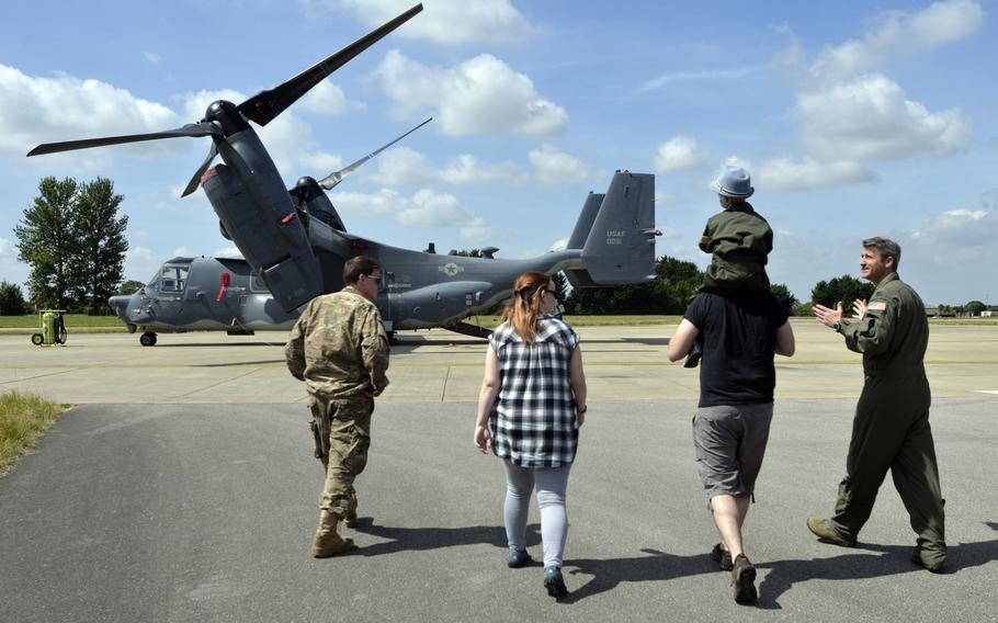 Airmen escort Martin and Keily Davidson with their 5-year-old son Jay during a tour of RAF Mildenhall, England, Friday, July 7, 2017. The 100th Air Refueling Wing invited the local boy, who was diagnosed with brain cancer, to become an honorary pilot for the day.