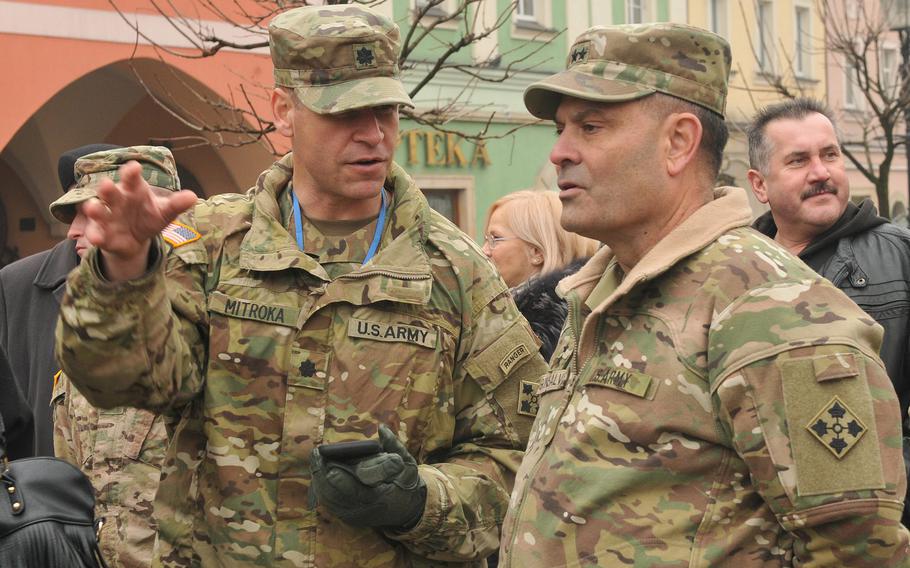 Lt. Col. George Mitroka, commander of 588th Brigade Engineer Battalion, 3rd Armored Brigade Combat Team, 4th Infantry Division speaks to Maj. Gen. Ryan F. Gonsalves, commanding general of 4th Infantry Division during a celebration ceremony to welcome American troops to Boleslawiec, Poland, Feb. 5, 2017.  