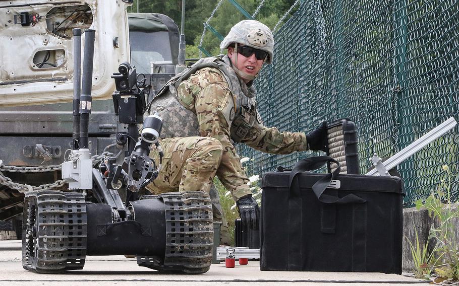 A soldier from the 774th Ordnance Company out of Fort Riley, Kan., prepares his equipment to investigate a possible explosive device during a KFOR 23 mission rehearsal exercise training scenario on Tuesday, July 4, 2017, at the Joint Multinational Readiness Center in Hohenfels, Germany.