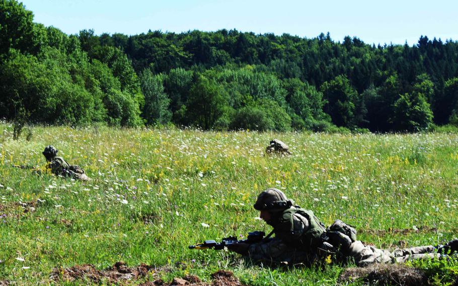 U.S. and British cadets take defensive positions during the exercise Dynamic Vistory, Thursday, July 13, 2017, in Hohenfels, Germany. 