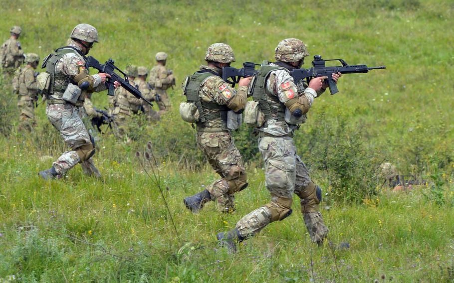 The infantry advances during a live-fire demonstration at the Center for Joint National Training in Cincu, Romania, Saturday, July 15, 2017. Troops from six countries participated in the demonstration that was part of the U. S. Army Europe-led exercise Saber Guardian 2017.