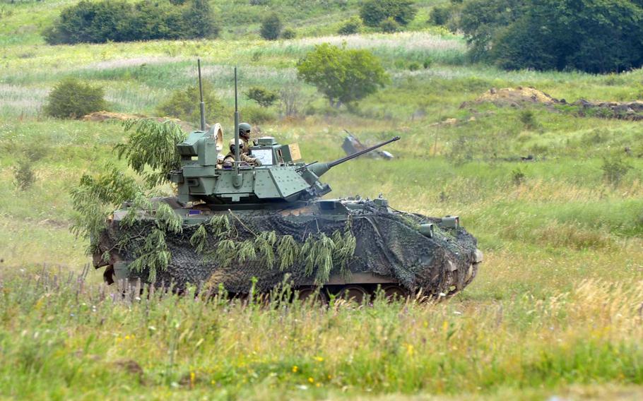 A Bradley Fighting Vehicle of the 4th Infantry Division rolls across the range during a live-fire demonstration at the Center for Joint National Training in Cincu, Romania, Saturday, July 15, 2017. The demonstration was part of the U. S. Army Europe-led exercise Saber Guardian 2017.