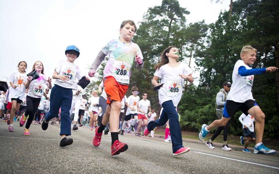 Runners take off from the starting line during the annual Color Run at Ramstein Air Base, Germany, on Saturday, Aug. 12, 2017. The race raised money for Operation Warmheart.

