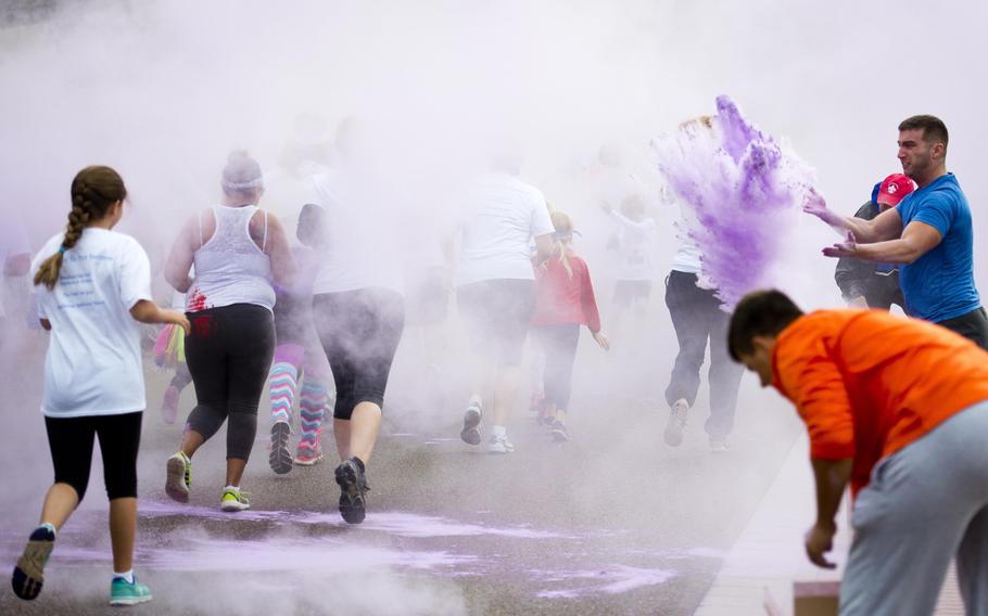 Participants run through the first color station during the Color Run at Ramstein Air Base, Germany, on Saturday, Aug. 12, 2017.

