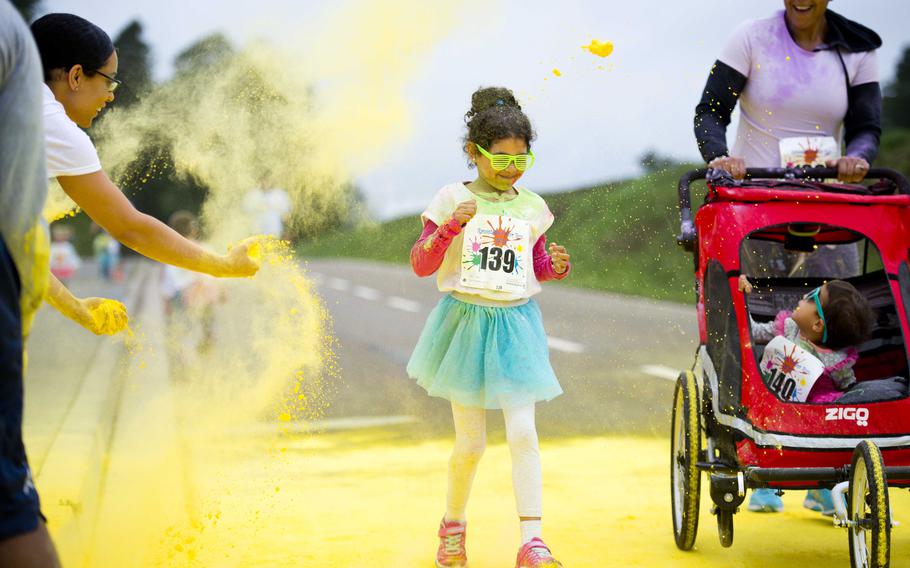 Participants run through colored powder during the annual Color Run 5K at Ramstein Air Base, Germany, on Saturday, Aug. 12, 2017.

