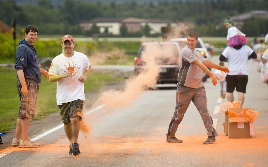 A runner almost gets through a color station unscathed during the Color Run at Ramstein Air Base, Germany, on Saturday, Aug. 12, 2017.

