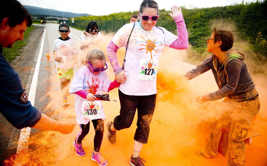 Participants run through colored powder during the Color Run at Ramstein Air Base, Germany, on Saturday, Aug. 12, 2017.

