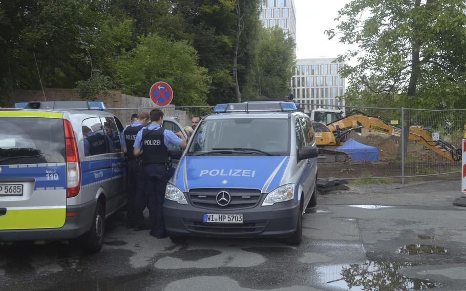 The area around an unexploded 1.8-ton bomb from WWII is blocked off by tape and fences, along with a detachment of police, on the west end of Frankfurt, Germany, on Thursday, Aug. 31, 2017. 