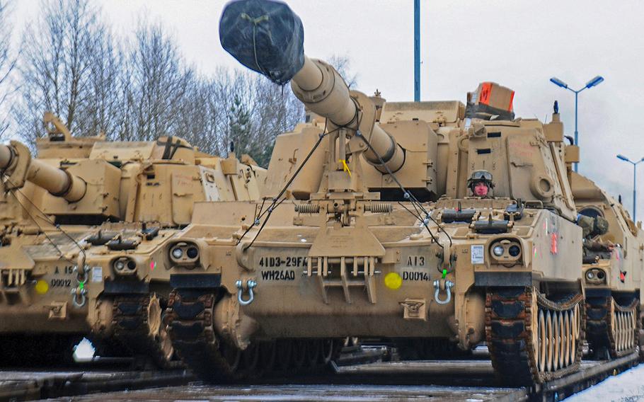 A U.S. soldier from 3rd Battalion, 29th Field Artillery Regiment, 3rd Armored Brigade Combat Team, 4th Infantry Division, drives an M109 Paladin self-propelled howitzer off of a flatcar in Drawsko Pomorskie, Poland, on Jan. 9, 2017. Police in Germany on Thursday, Jan. 11, 2018, halted the shipment of six U.S. Army M109 howitzers because they lacked the proper paper work.
