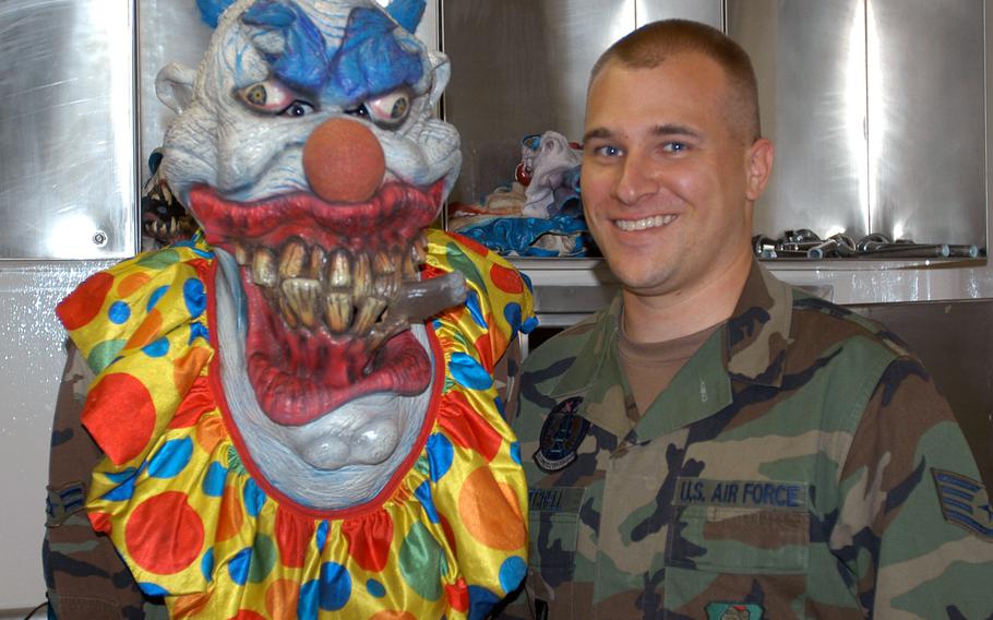 Then-Staff Sgt. Jerred Mitchell of the 35th Communications Squadron at Misawa Air Base, Japan, stands next to one of the scary clowns that was haunting the squadron's Haunted Dungeon in 2007. Mitchell, now a master sergeant at  Ramstein Air Base, Germany, almost lost his pension due to being medically retired from the Air Force.

