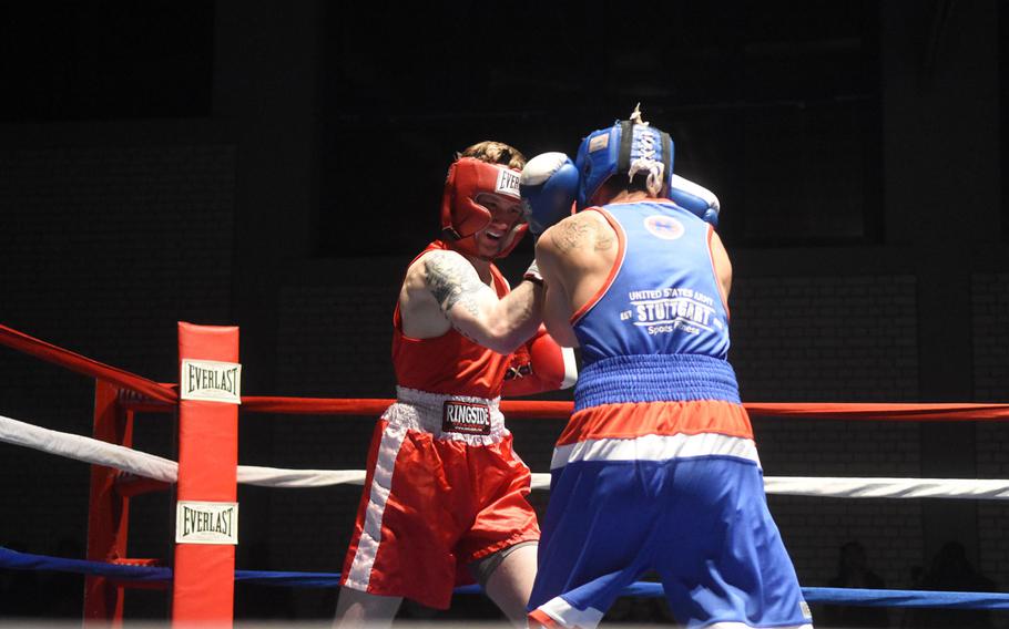 Vilseck's Bradon Petrig lands a punch on Stuttgart's Simon Martinez, during the U.S. Army Garrison Bavaria St. Patrick's Day Boxing Invitational, Saturday, March 17, 2018, at Vilseck, Germany. 