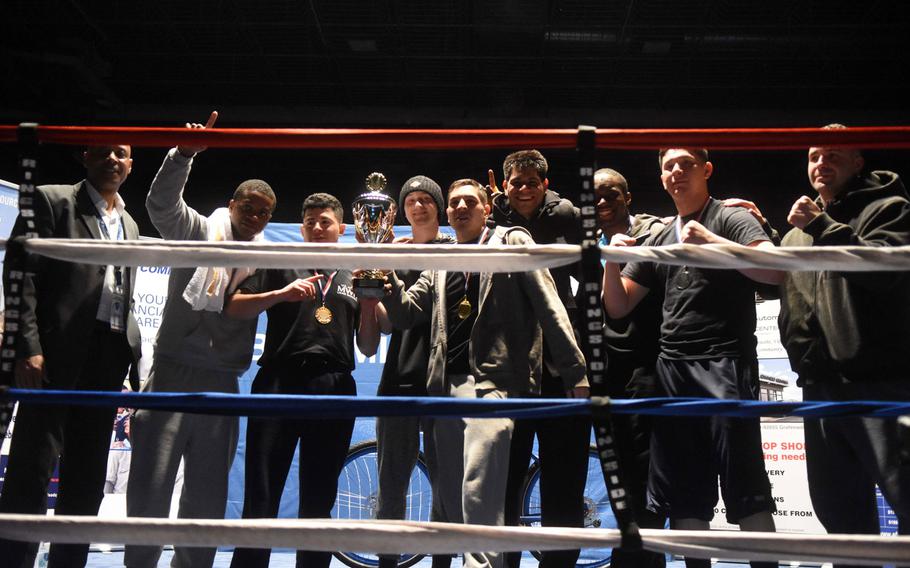 Boxers with the Vilseck team hold up their first place trophy at the U.S. Army Garrison Bavaria St. Patrick's Day Boxing Invitational, Saturday, March 17, 2018, at Vilseck, Germany. Organizers later figured out that the points had been tallied incorrectly and Stuttgart was the winner.