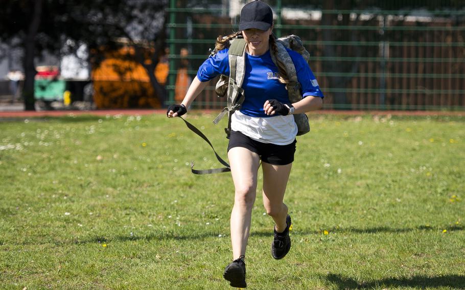U.S. Air Force Tech Sgt. Robin Pryor runs with a rucksack during the CLEAR Challenge at Ramstein Air Base, Germany, on Friday, April 20, 2018. Pryor is a member of When Doves Fly, a 76th Airlift Squadron Team.