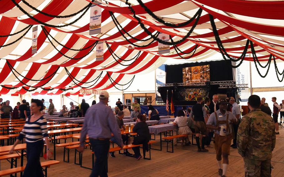 Americans and Germans get some shade under the beer tent at the German-American Volksfest at Hohenfels, Friday, May 11, 2018. 
