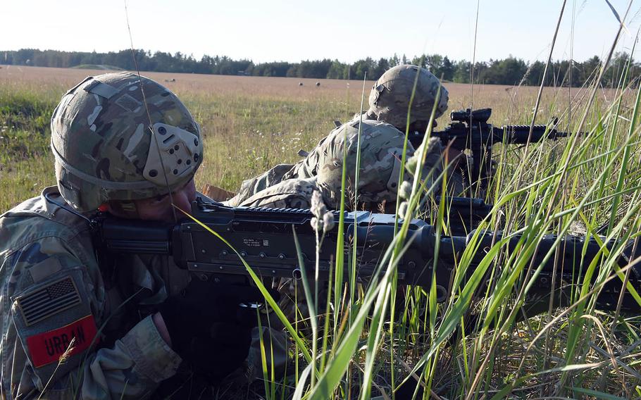 Soldiers with the 173rd Brigade Combat Team (Airborne) provides security during an artillery live-fire exercise at Grafenwoehr, Germany, Friday, May 18, 2018. 