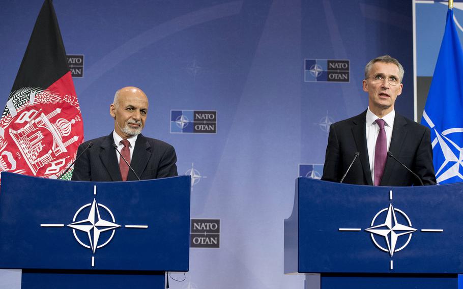Afghan President Ashraf Ghani and NATO Secretary-General Jens Stoltenberg appear at a news conference at NATO headquarters in 2014. Kabul announced on Tuesday, June 5, 2018, that it had approved an offer by the United Arab Emirates to provide troops to NATO's Resolute Support mission.