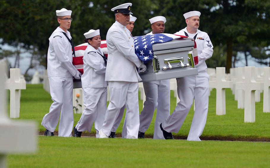 Honorary pallbearers from the U.S. Naval Hospital Naples, Italy, carry the coffin of Julius “Henry” Pieper to its final resting place during a ceremony at Normandy American Cemetery in Colleville-sur-Mer, France, Tuesday, June 19, 2018.  



