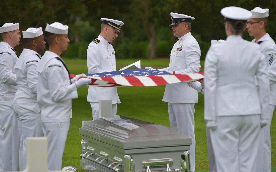 U.S. Navy Chaplain (Lt.) Ken Stiles of Naval Support Activity, Naples, Italy, center, reads a reflection at the memorial service for Julius “Henry” Pieper at Normandy American Cemetery in Colleville-sur-Mer, France, Tuesday, June 19, 2018.  



