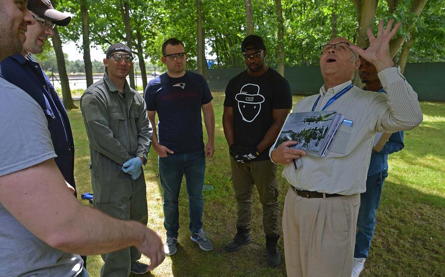 Norbert Kandzorra, right, a former Lufthansa employee, tells airmen of Ramstein Air Base's 86th Maintenance Squadron about the Berlin Airlift, Saturday, June 23, 2018. Kandzorra, 71, received his first pair of baby shoes from an American CARE package.