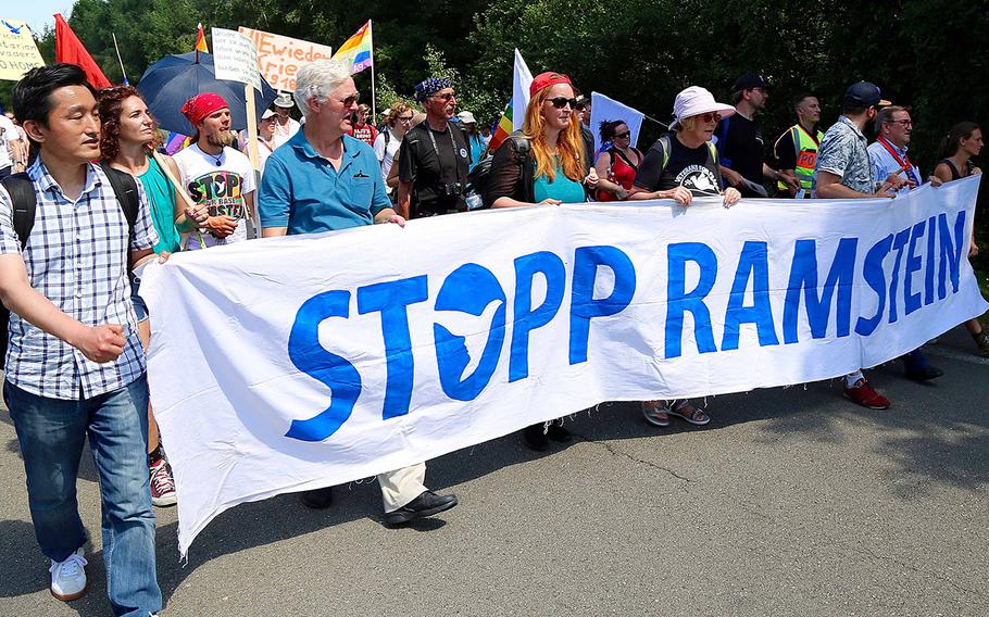 Protesters march outside Ramstein Air Base, demanding its closure, on June 30, 2018. The protesters claim the base is being used to relay signals to drones being used to fight Islamic militants.

