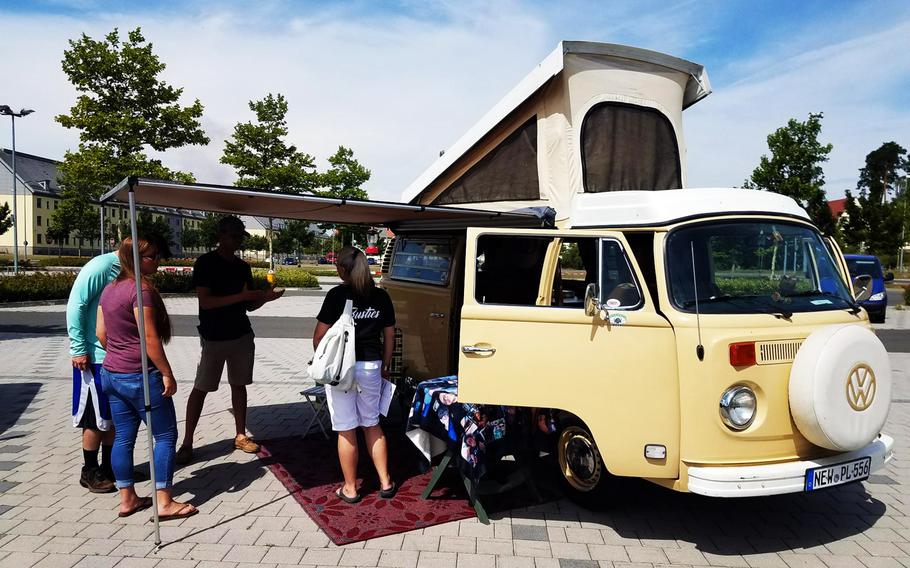 Soldiers and families check out a Volkswagen bus at the Independence Day car show put on by the Better Opportunities for Single Soldiers program, at Grafenwoehr, Germany, Wednesday, July 4, 2018. 
