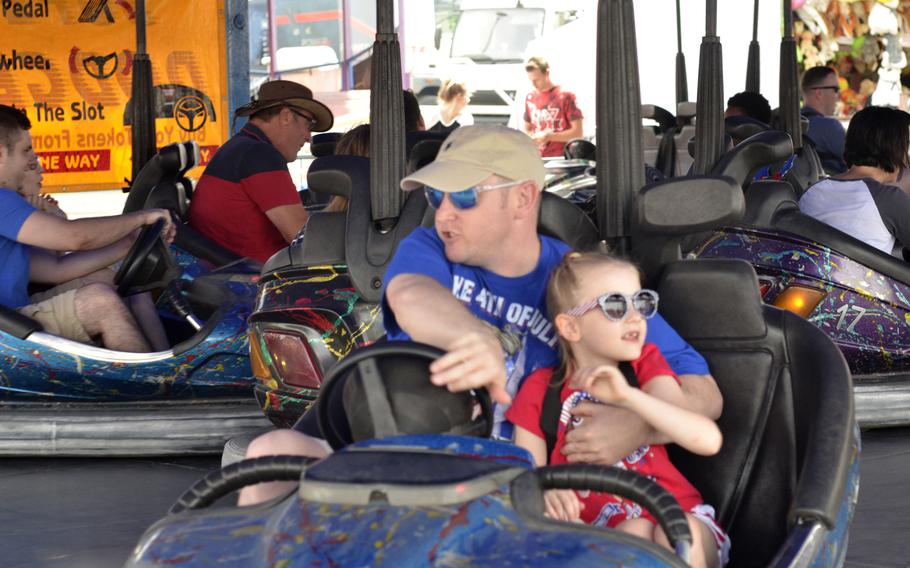 Airmen and families of the 48th Fighter Wing celebrate Independence Day during Liberty Fest at RAF Lakenheath, England, July 4, 2018. The annual event included a carnival, car show, food trucks and stalls, three live cover bands and a fireworks display.