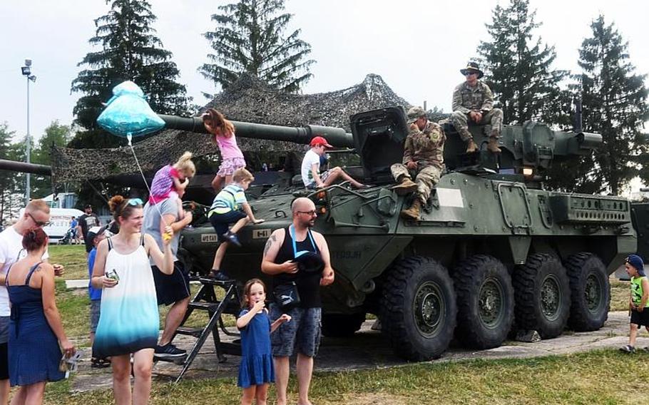 German and American kids climb on a U.S. Army Stryker at the German-American Volksfest at Grafenwoehr, Germany, Friday, Aug. 3, 2018. 