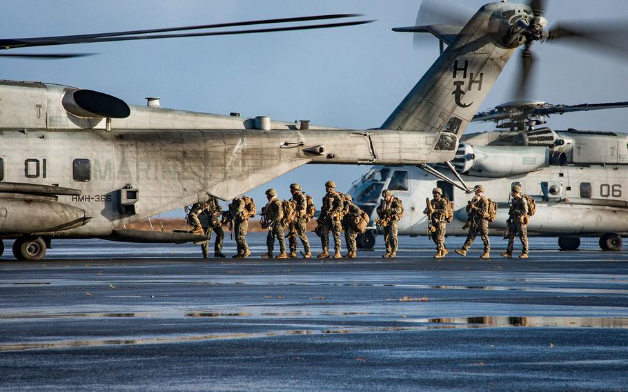 Marines, assigned to the 24th Marine Expeditionary Unit, embark a CH-53 Super Stallion helicopter, during a simulated air assault as part of exercise Trident Juncture 2018 in Keflavik, Iceland, Oct. 17, 2018. 