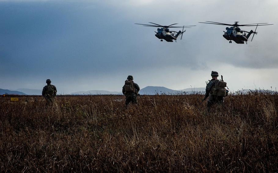 CH-53 Super Stallion helicopters, assigned to the 24th Marine Expeditionary Unit, prepare to retrieve U.S. Marines during a simulated air assault as part of exercise Trident Juncture 2018 in Keflavik, Iceland, Oct. 17, 2018. 