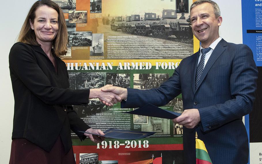 U.S. Acting Assistant Secretary of Defense for International Security Affairs Katherine Wheelbarger and Lithuanian Policy Director Robertas Sapronas pose after signing the U.S-Lithuania Defense Cooperation Strategic Roadmap at the Pentagon, April 2, 2019.