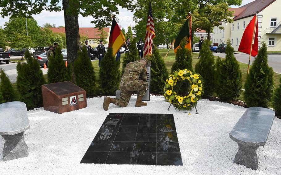 Brig. Gen. Christopher Laneve, commander of the 7th Army Training Command, pays his respects to the soldiers who died in combat from the 18th Military Police Brigade, during a ceremony Thursday, May 23, 2019, at Vilseck, Germany. 

