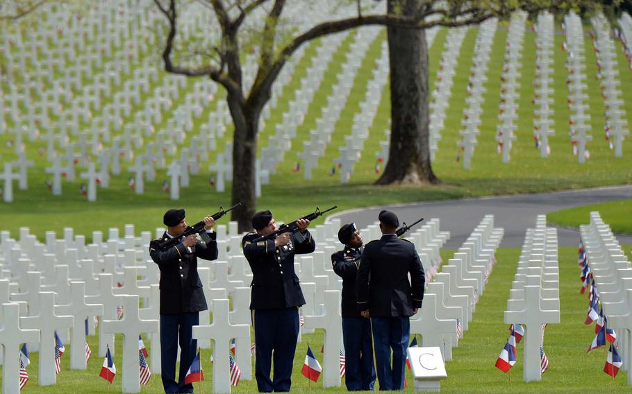 A firing team from the 2nd Cavalry Regiment out of Vilseck, Germany, fires volleys at Memorial Day ceremony at Lorraine American Cemetery in St. Avold, France, Sunday, May 26, 2019. With 10,489 graves, the cemetery is the largest World War II U.S. World War II cemetery in Europe.