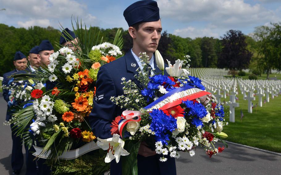 Airmen from Ramstein Air Base, Germany, prepare to present wreaths during the Memorial Day ceremony at Lorraine American Cemetery in St. Avold, France, Sunday, May 26, 2019. 








