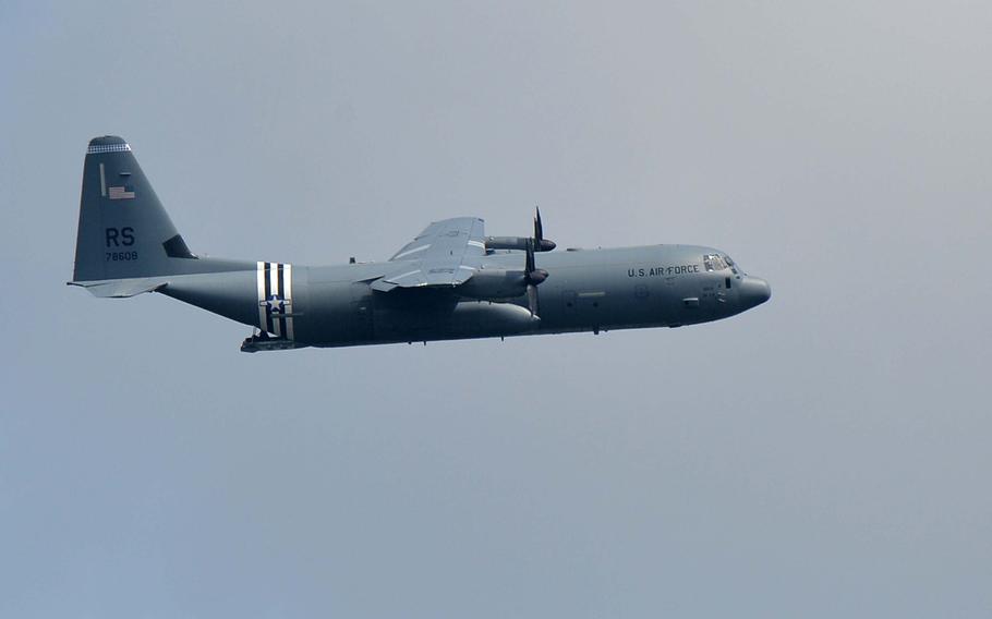 A C-130 from the 86th Airlift Wing's 37th Airlift Squadron, out of Ramstein Air Base, Germany, does a flyover during the Memorial Day ceremony at Lorraine American Cemetery in St. Avold, France, Sunday, May 26, 2019.