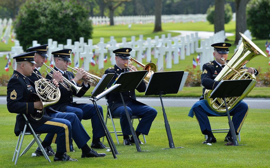 The U.S. Army Europe's brass quintet plays at the Memorial Day ceremony at Lorraine American Cemetery in St. Avold, France, Sunday, May 26, 2019.