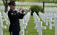 Sgt. William Hamilton of the U.S. Army Europe Band plays a perfect rendition of taps at the conclusion of the Memorial Day Ceremony at Lorraine American Cemetery in St. Avold, France, Sunday, May 26, 2019. 










