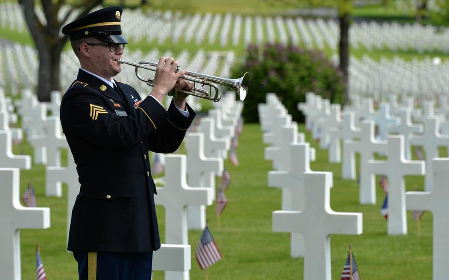 Sgt. William Hamilton of the U.S. Army Europe Band plays a perfect rendition of taps at the conclusion of the Memorial Day Ceremony at Lorraine American Cemetery in St. Avold, France, Sunday, May 26, 2019. 