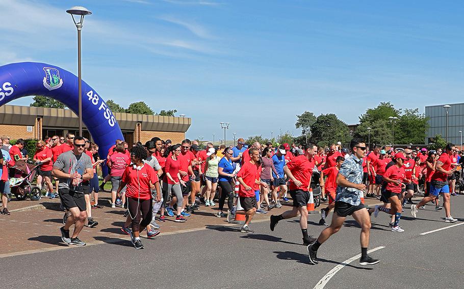 Servicemembers, civilians, family members and furry friends start the 5-kilometer Freedom Run on Thursday July 4, 2019, on RAF Lakenheath, England. The run is held before the opening of the Liberty Fest each year. 