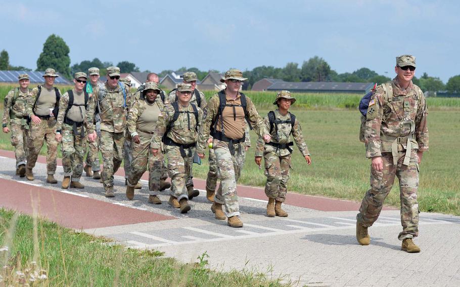 Col. Jason Dickerman leads a team from SHAPE out of Gassel, Netherlands, on the way to Nijmegen on the last day of the Nijmegen Four Days Marches, Friday, July 19, 2019.