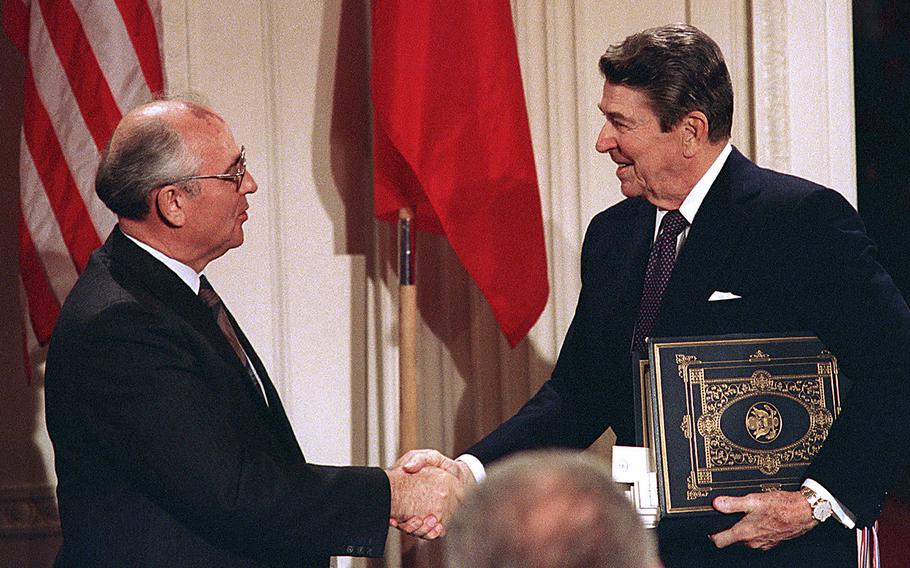 In this Dec. 8, 1987, file photo, President Ronald Reagan, right, shakes hands with Soviet leader Mikhail Gorbachev after the two leaders signed the Intermediate Range Nuclear Forces Treaty to eliminate intermediate-range missiles during a ceremony in the White House East Room in Washington. The U.S. and Russia both walked away from the landmark deal on Friday, Aug. 2, 2019.