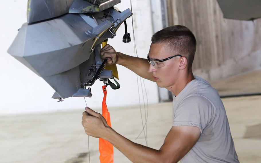 Airman 1st Class Alexander Schmitz, a weapons load crew member assigned to the 31st Aircraft maintenance Squadron, 31st Fighter Wing, Aviano Air Base, Italy prepares an F-16 Fighting Falcon for munitions loading during the 2019 Combat Ammunition Production Exercise being held at Aviano, Aug. 8, 2019. Loading of munitions onto fighter jets was added to the exercise this year, a process that will remain part of CAPEX going forward. 

