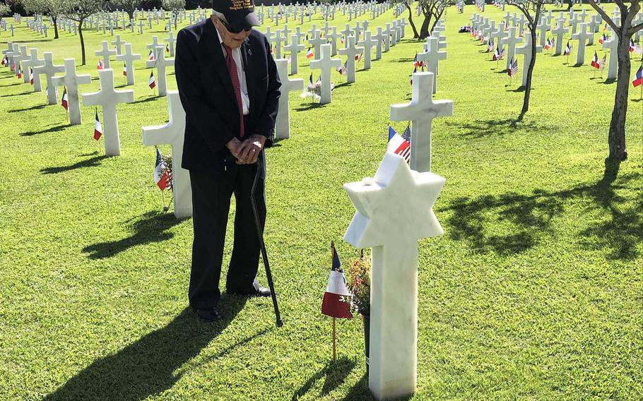 On the 75th anniversary of Operation Dragoon, the World War II invasion of southern France, veteran Allan Johnson stands among the graves at Rhone American Cemetery in Draguignan, France, and pays his respects to Pvt. Henry Wikins, a fellow member of the 517th Parachute Regimental Combat Team.