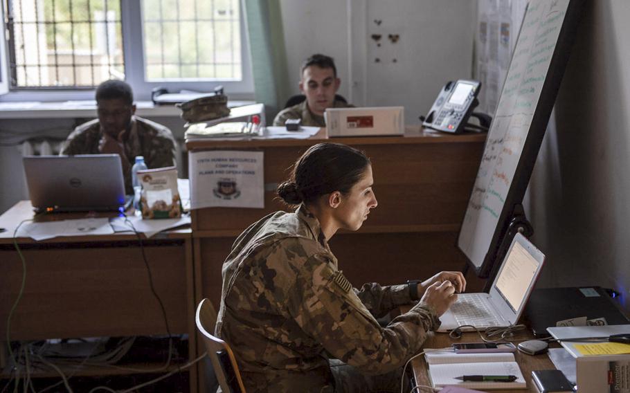 First Lt. Veronica Smith, human resources executive officer, works on her computer in the command building on a military base in Powidz, Poland, Aug. 27, 2019. The first floor of the building is offices while the second and third floors are dorm rooms. 

