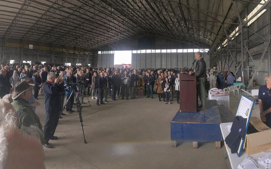 Reporters and locals from Fairford listen to Lt. Col. Joseph Knothe, the base commander, at the 75th Heritage Day Celebration on Friday, Sept. 6, 2019.