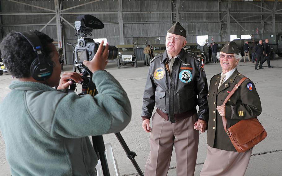 Airman Gabrielle Winn records  a video message from British citizens Clifford and Pamela Grundy to the airmen of RAF Fairford on Friday, Sept. 6, 2019.