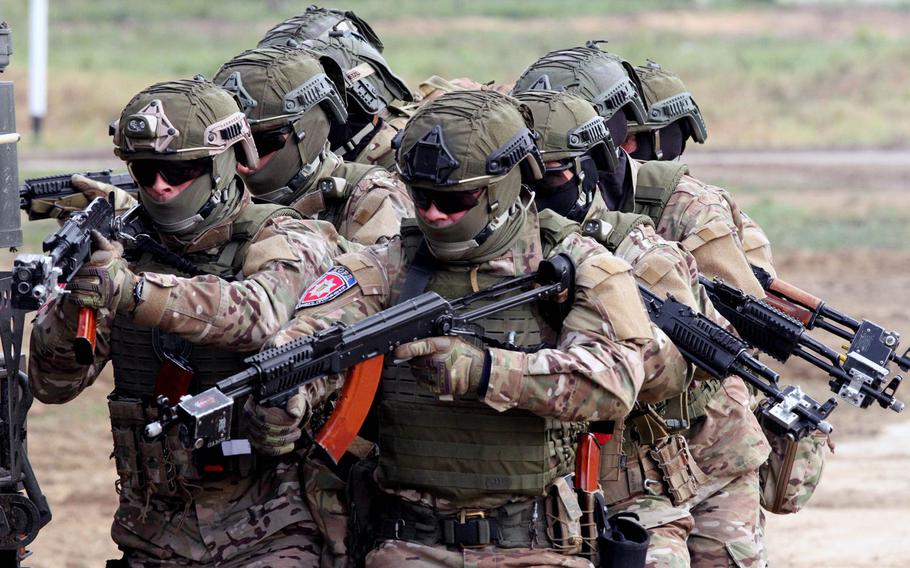 A Ukrainian special forces team moves in unison and prepares to rescue a hostage Sept. 20 during the multinational Rapid Trident exercise involving NATO and Ukrainian troops in Sept. 2019 in Yavoriv, Ukraine.