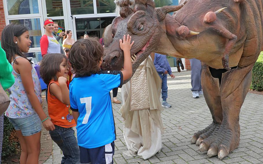 Children are greeted by a dragon at the entrance to the Galaxy Club on RAF Mildenhall on Saturday, Oct 5, 2019. 