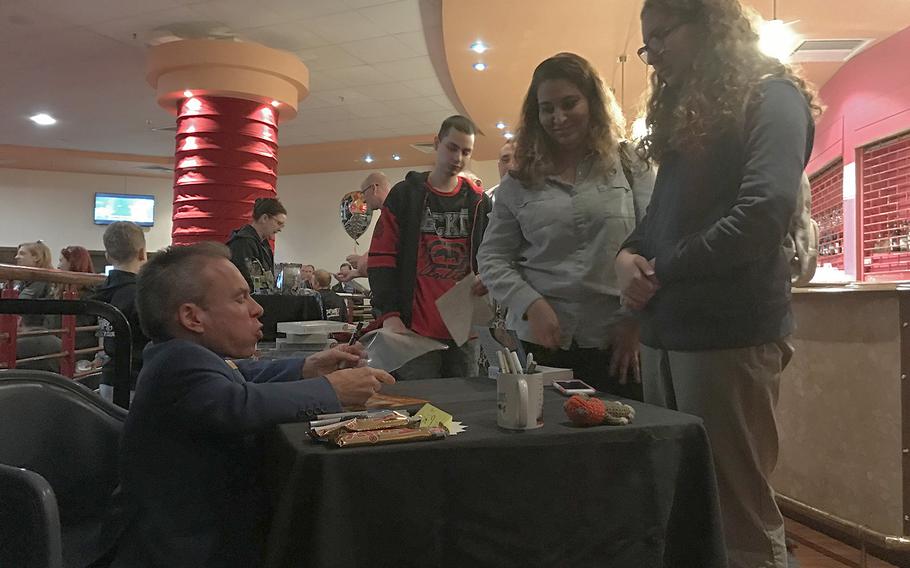 Actor Warwick Davis signs autographs during Mil-D-Con on RAF Mildenhall on Saturday, Oct 5, 2019. 

