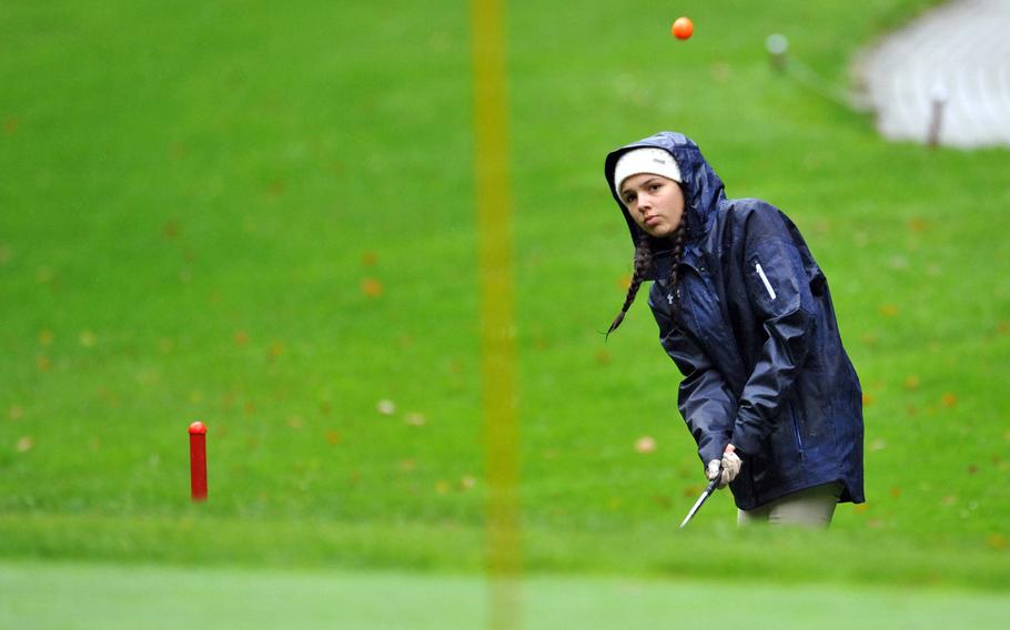 Lakenheah's Prasila Castro watches her chip fly towards the hole during opening day action at the DODEA-Europe high school golf championships in Wiesbaden, Germany, Oct. 9, 2019. Castro scored a modified Stableford 3 points on the day.










