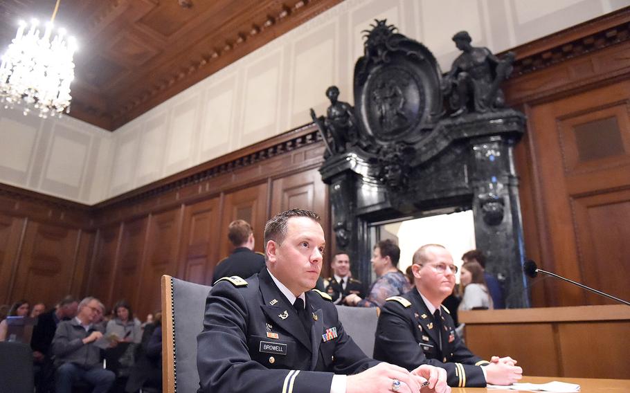Maj. Andrew Browell, left, and Capt. Andrew Nist, await the mock U.S. military trial at  Courtroom 600 of the Nuremberg Palace of Justice, in Nuremberg, Germany, Saturday, Oct. 19, 2019.